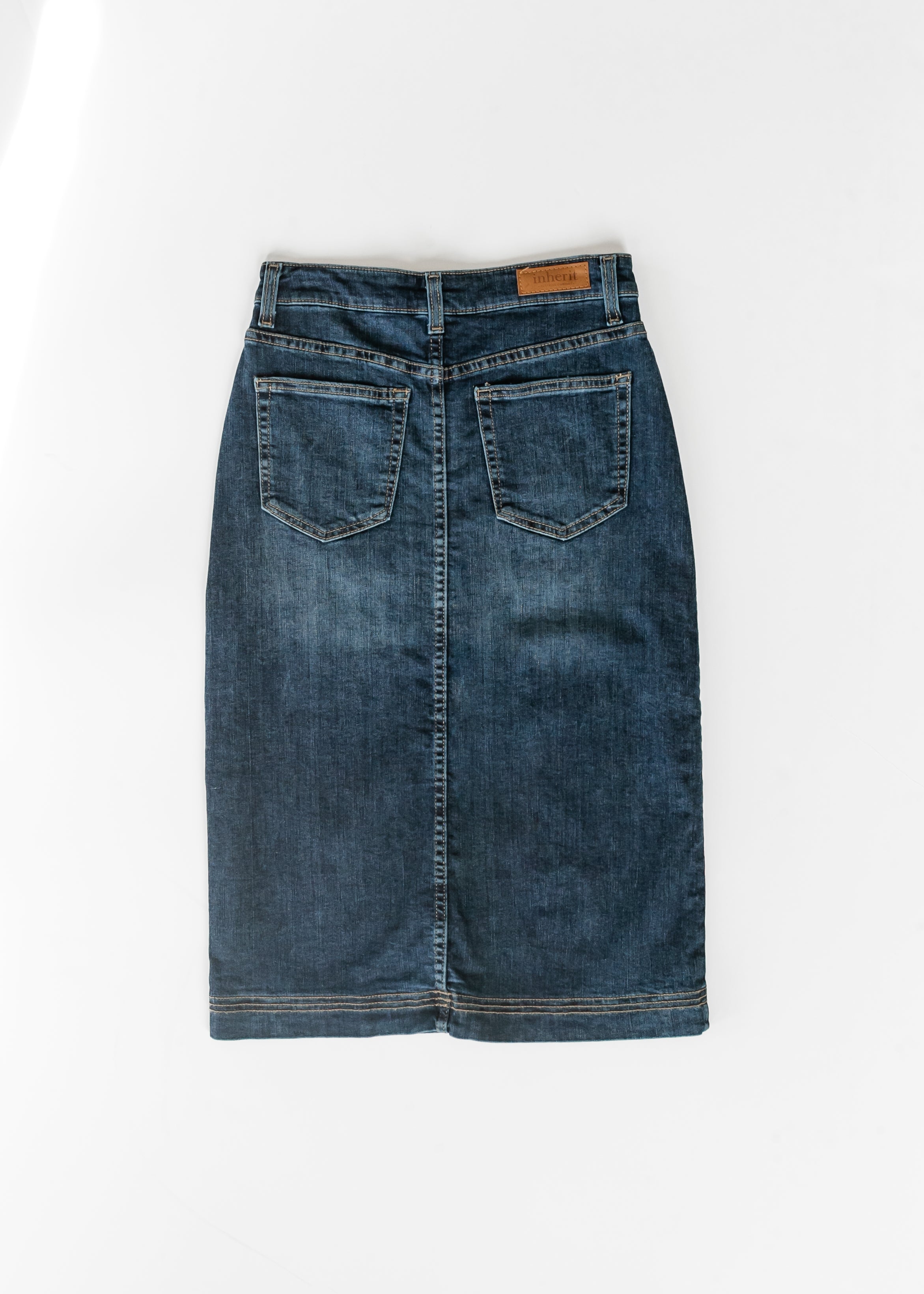 Blue denim skirt on a white background