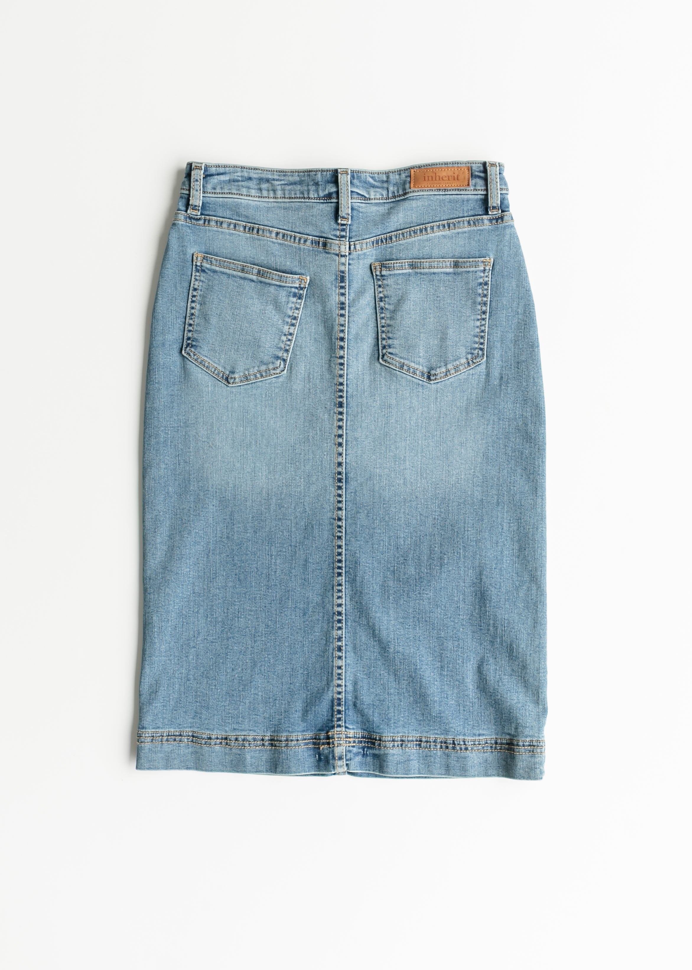 Light blue denim skirt on a white background