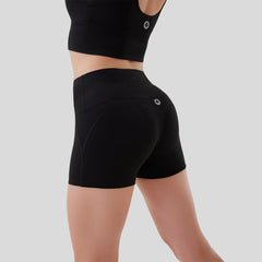Black athletic shorts worn by a person on a gray background