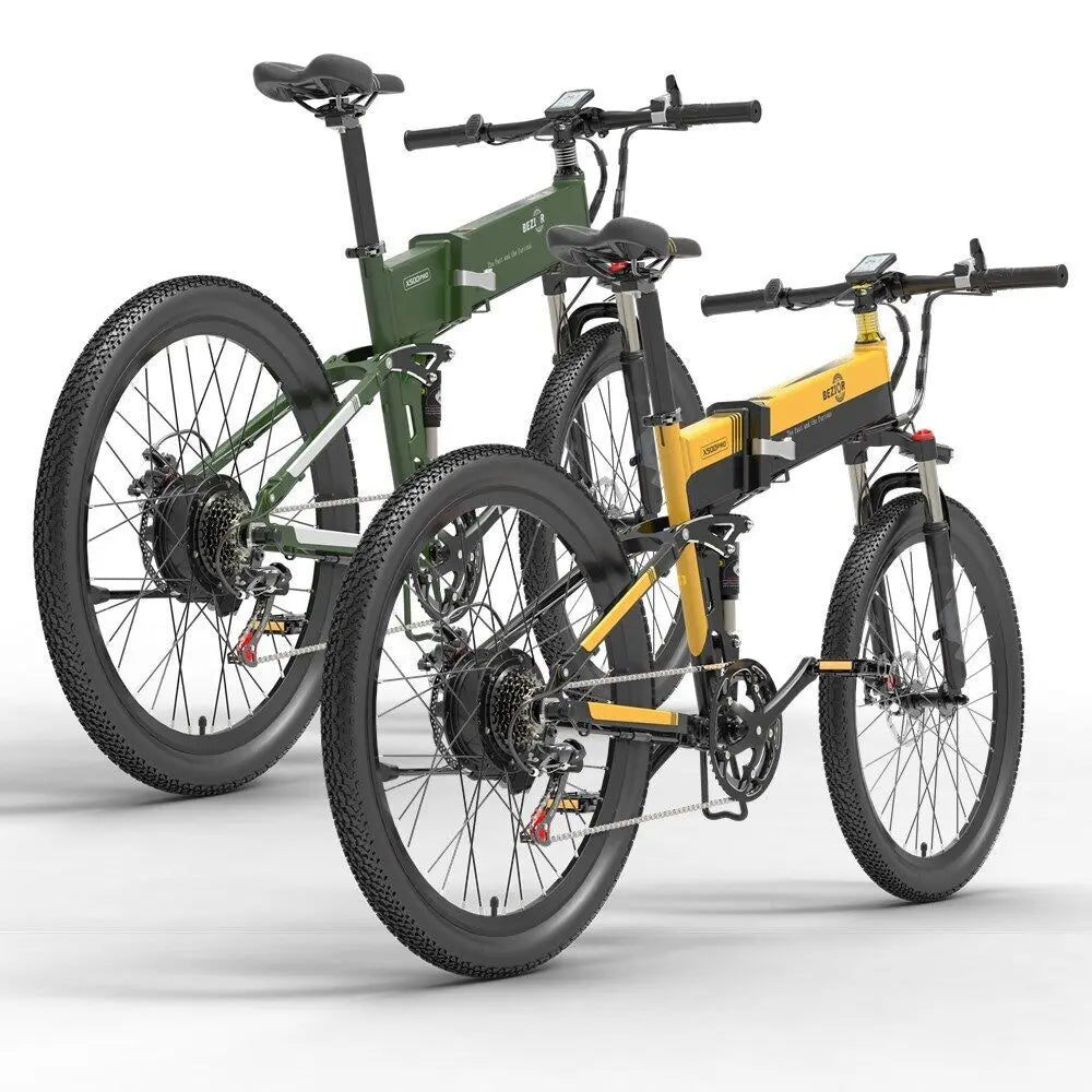 Two electric mountain bikes, one with a green frame and the other with a yellow frame, both having black tires and silver accents.