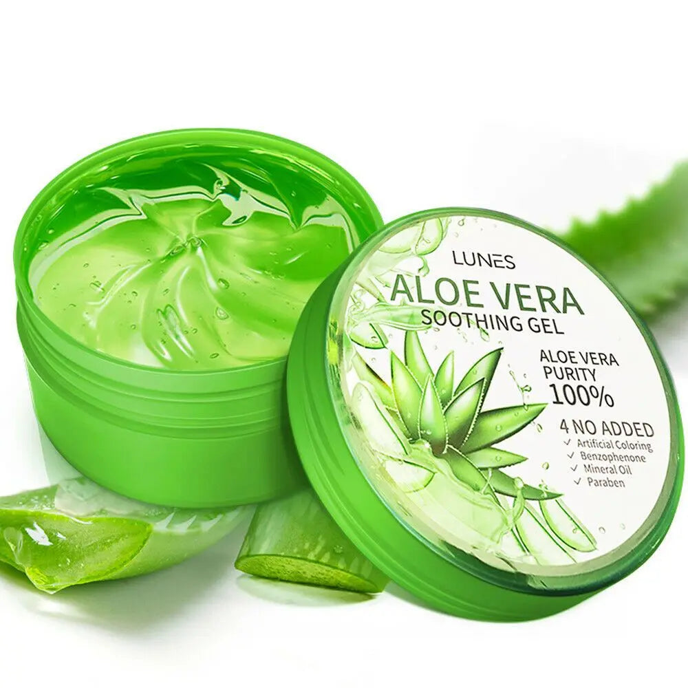 A jar of Aloe Vera soothing gel with a green lid, alongside slices of aloe vera and aloe leaves. The label on the jar indicates it is 100% pure Aloe Vera gel.