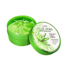 A jar of Aloe Vera soothing gel with a green lid, alongside slices of aloe vera and aloe leaves. The label on the jar indicates it is 100% pure Aloe Vera gel.