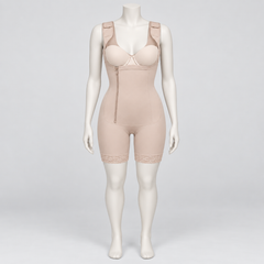 A beige full-body compression shapewear suit displayed on a female mannequin against a light gray studio background. The garment includes underwire cups, a front zipper, seamless shaping, and lace trim at the thighs.