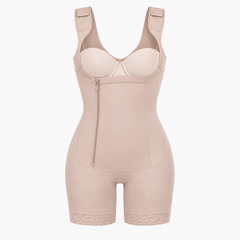 A beige full-body compression shapewear bodysuit with shoulder straps, a front zipper, molded cup sections, and lace trim at the hem, shown on a plain white background.