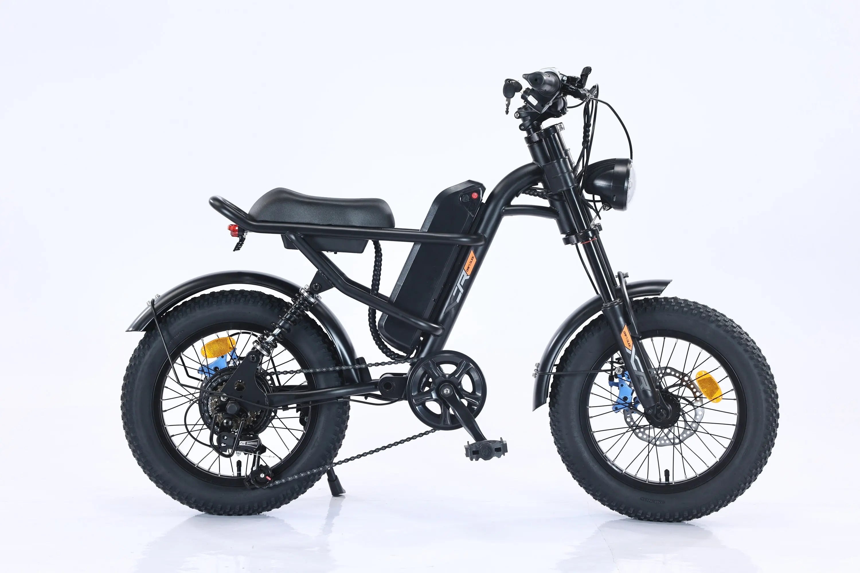 Black electric bike with a step-through frame and fat tires, equipped with a front and rear shock absorption system, on a white background.
