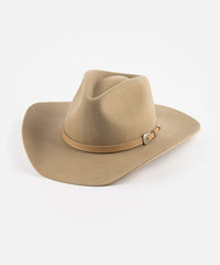 Tan cowboy hat with a band on a white background