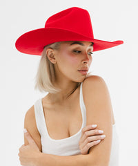 Woman wearing a red hat on a white background