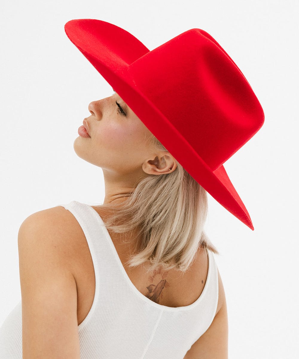 Woman wearing a red hat on a white background