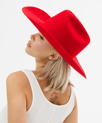 Woman wearing a red hat on a white background