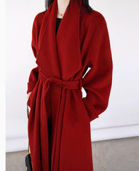 Red coat worn by a person on a white background
