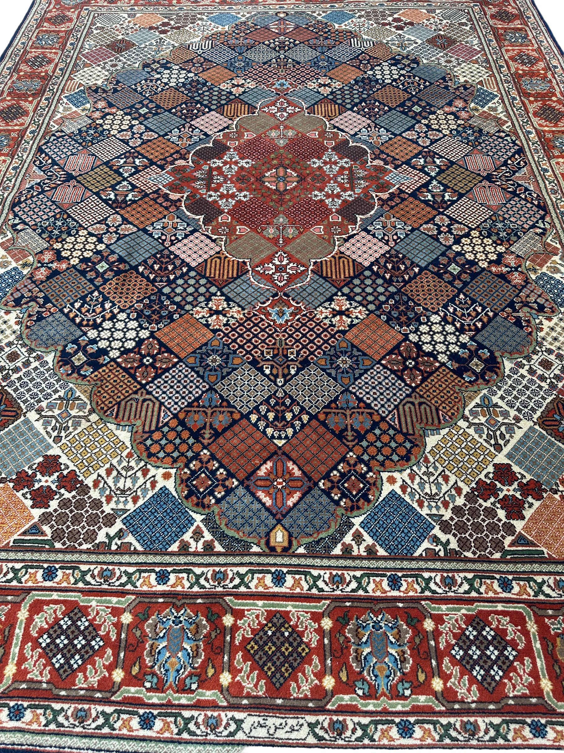 Hand-Knotted Indo-Joshegan Wool Rug – 12'2" x 9'1" – Geometric Medallion Design, Rich Warm Palette Rugistan