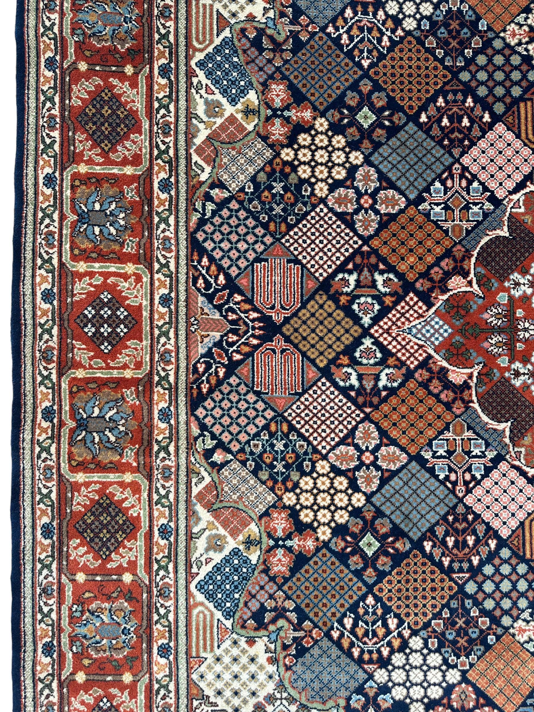 Hand-Knotted Indo-Joshegan Wool Rug – 12'2" x 9'1" – Geometric Medallion Design, Rich Warm Palette Rugistan