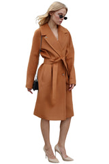 Woman wearing a brown coat on a white background