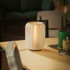 Wooden lamp on a table with a blurred background