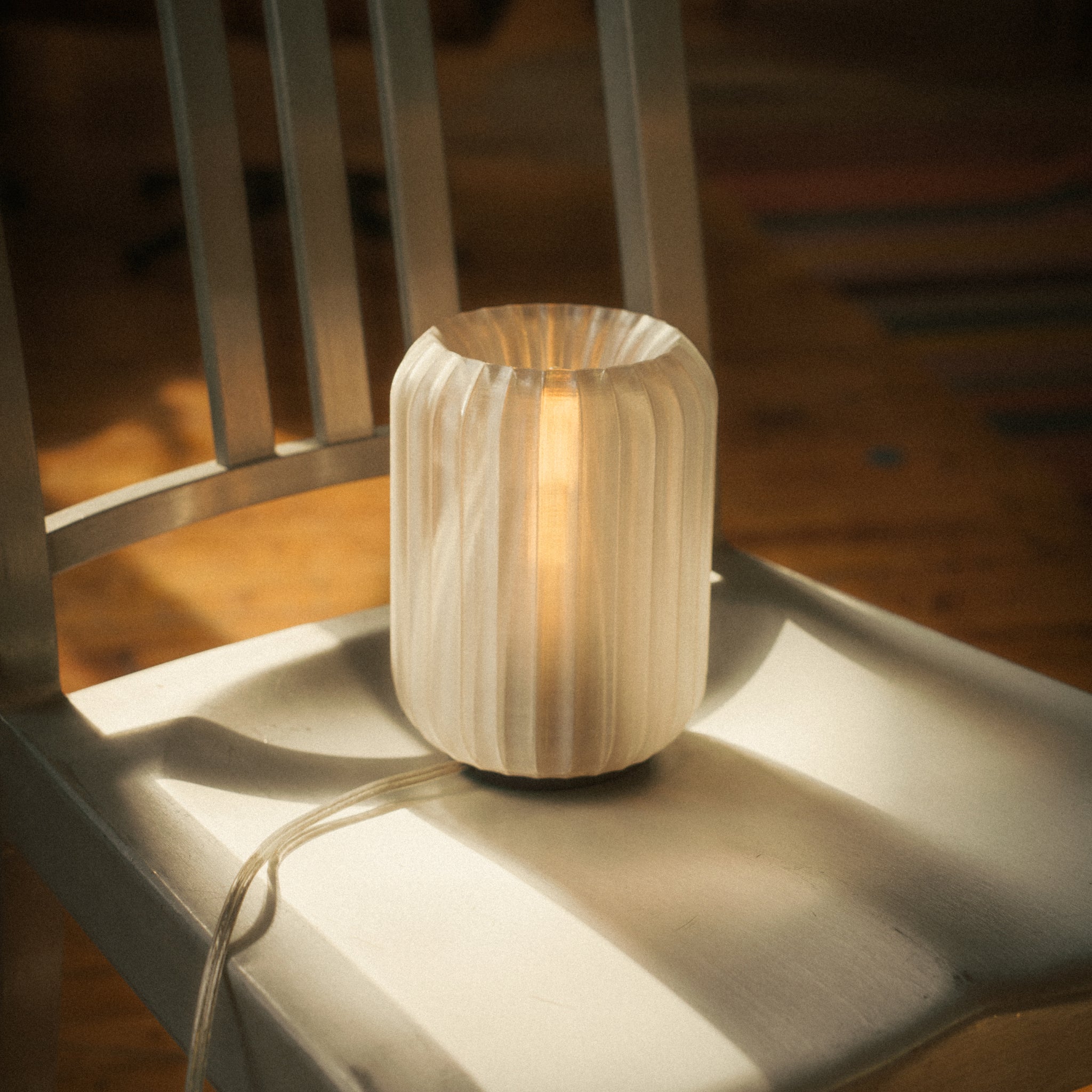 Wooden lamp on a chair with warm glow