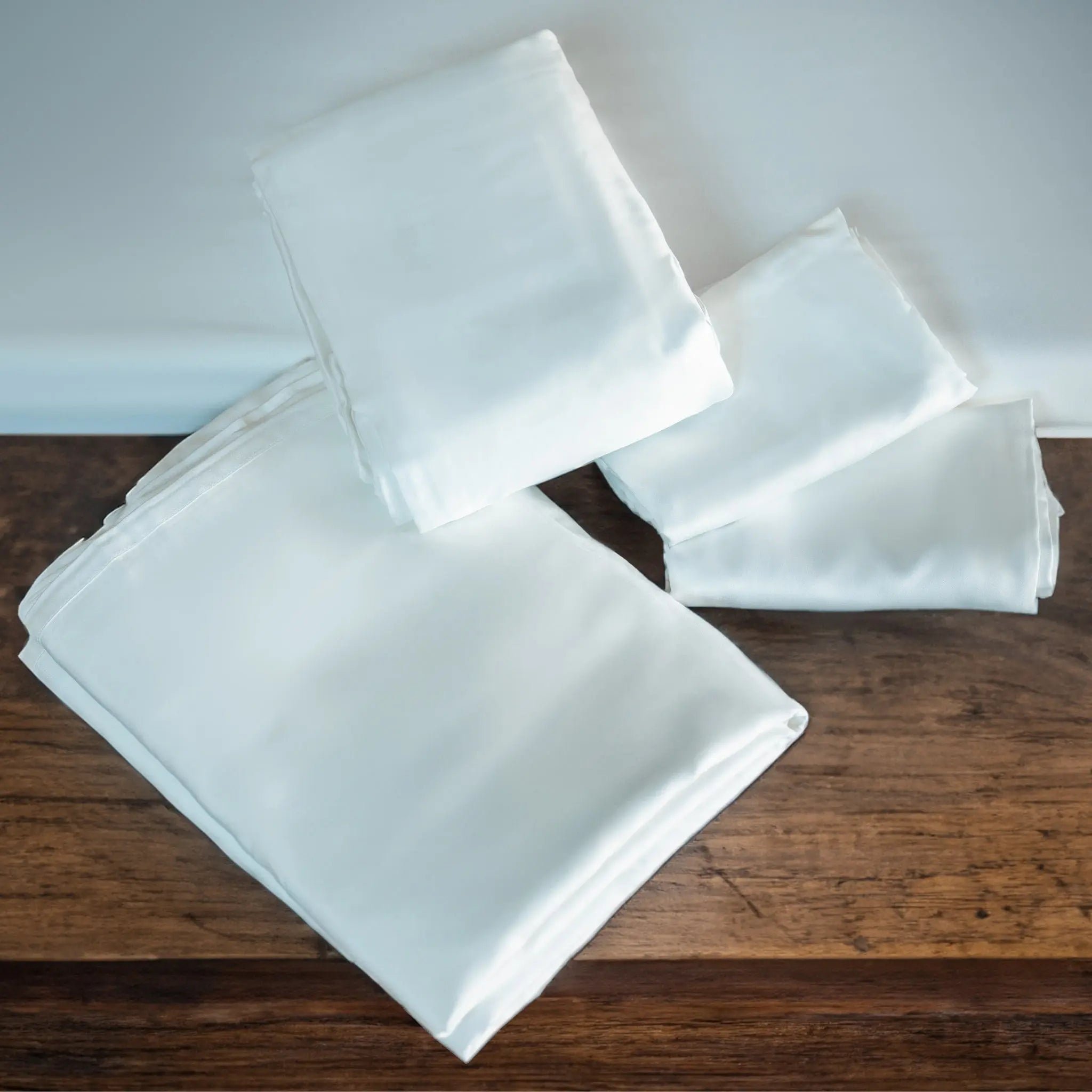 White napkins on a wooden surface