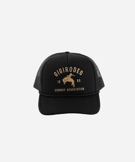 Black trucker cap with gold text and logo on a white background