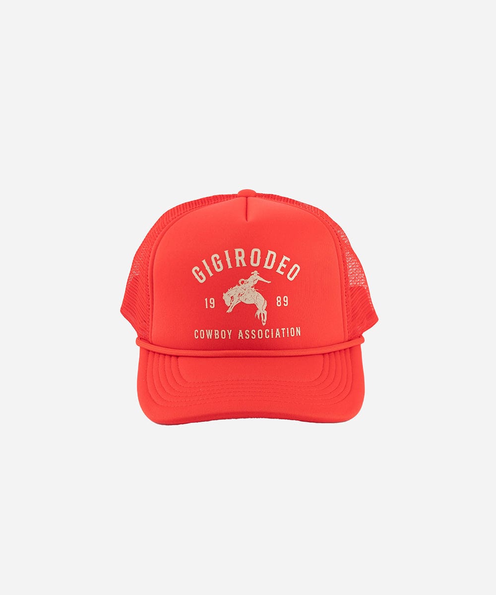Red trucker hat with white text and graphics on a white background