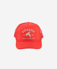 Red trucker hat with white text and graphics on a white background