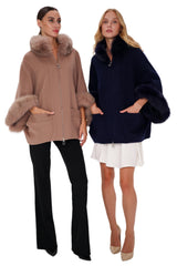 Two women wearing fur-lined hooded jackets on a white background