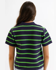 Person wearing a navy and green striped polo shirt on a white background