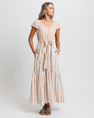 Woman wearing a striped dress on a white background