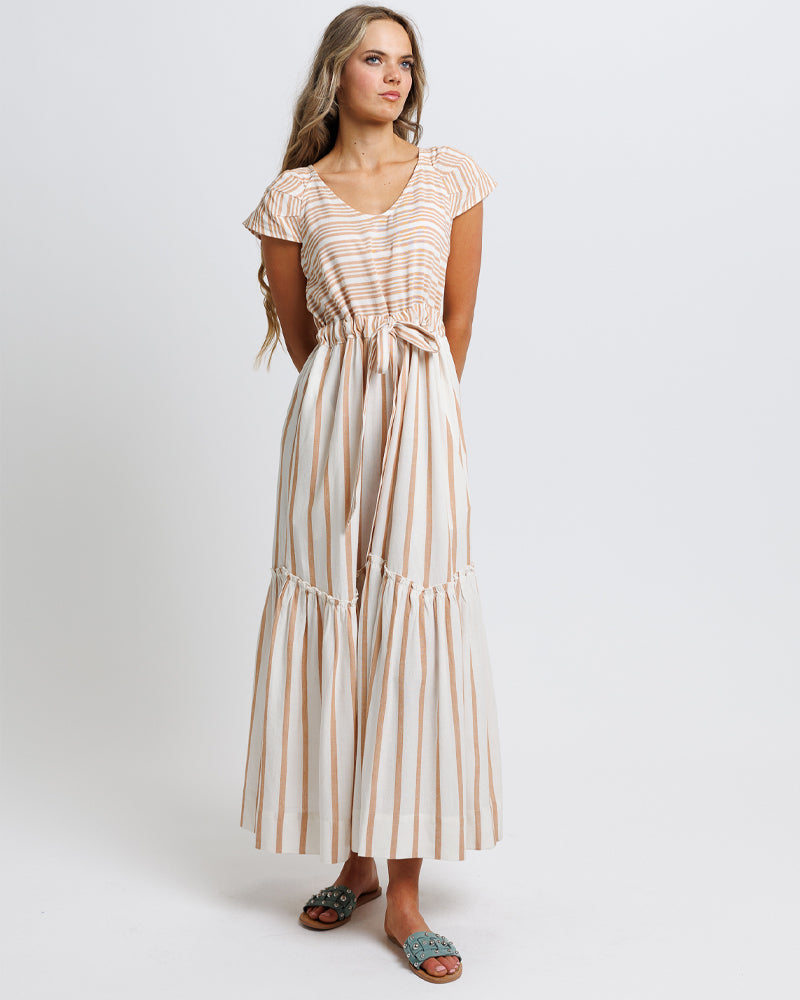 Woman wearing a striped dress on a white background