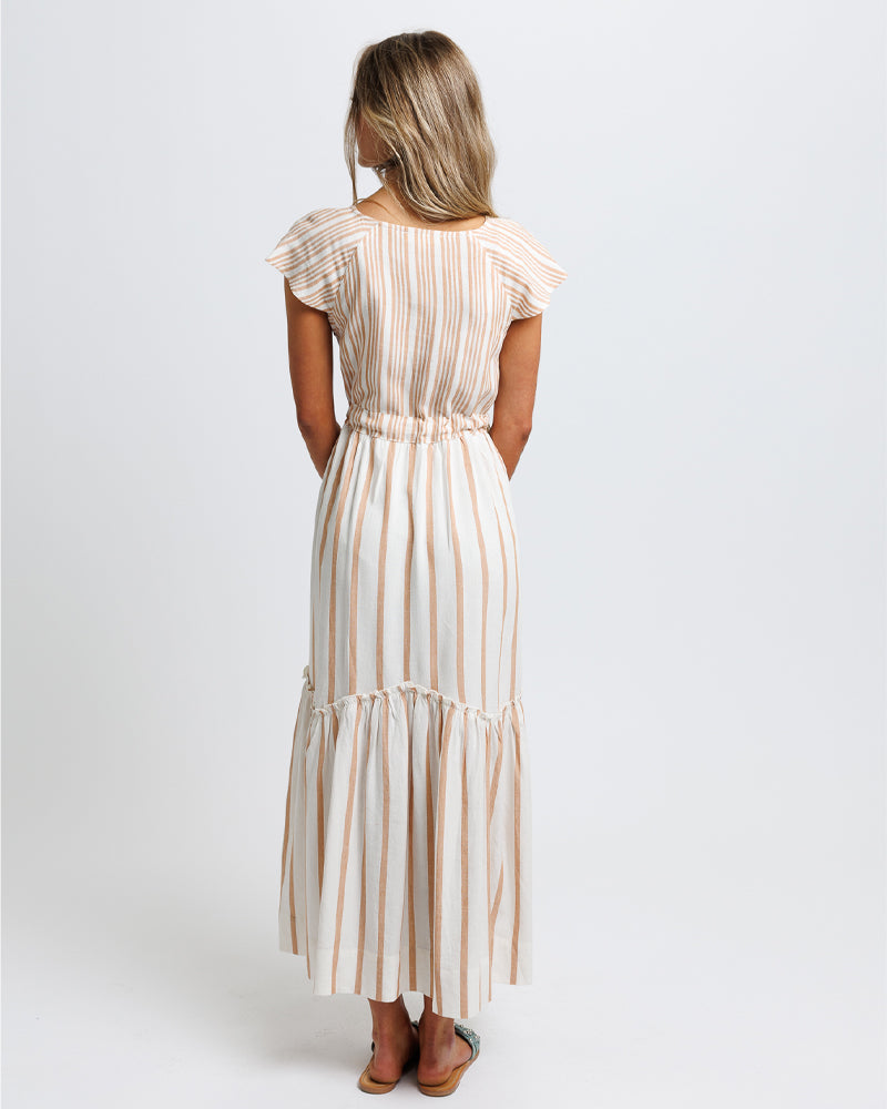 Woman wearing a striped dress on a white background