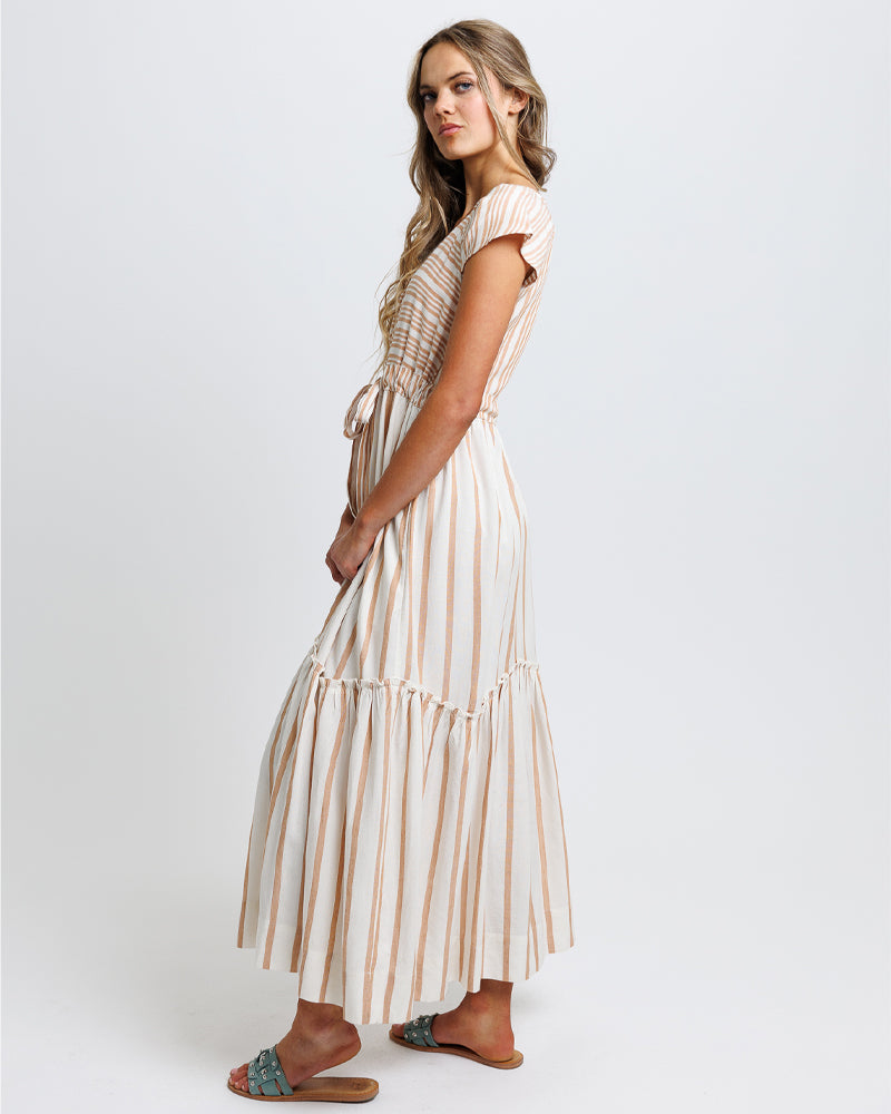 Woman wearing a striped dress on a white background