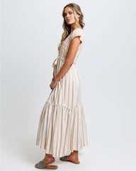 Woman wearing a striped dress on a white background