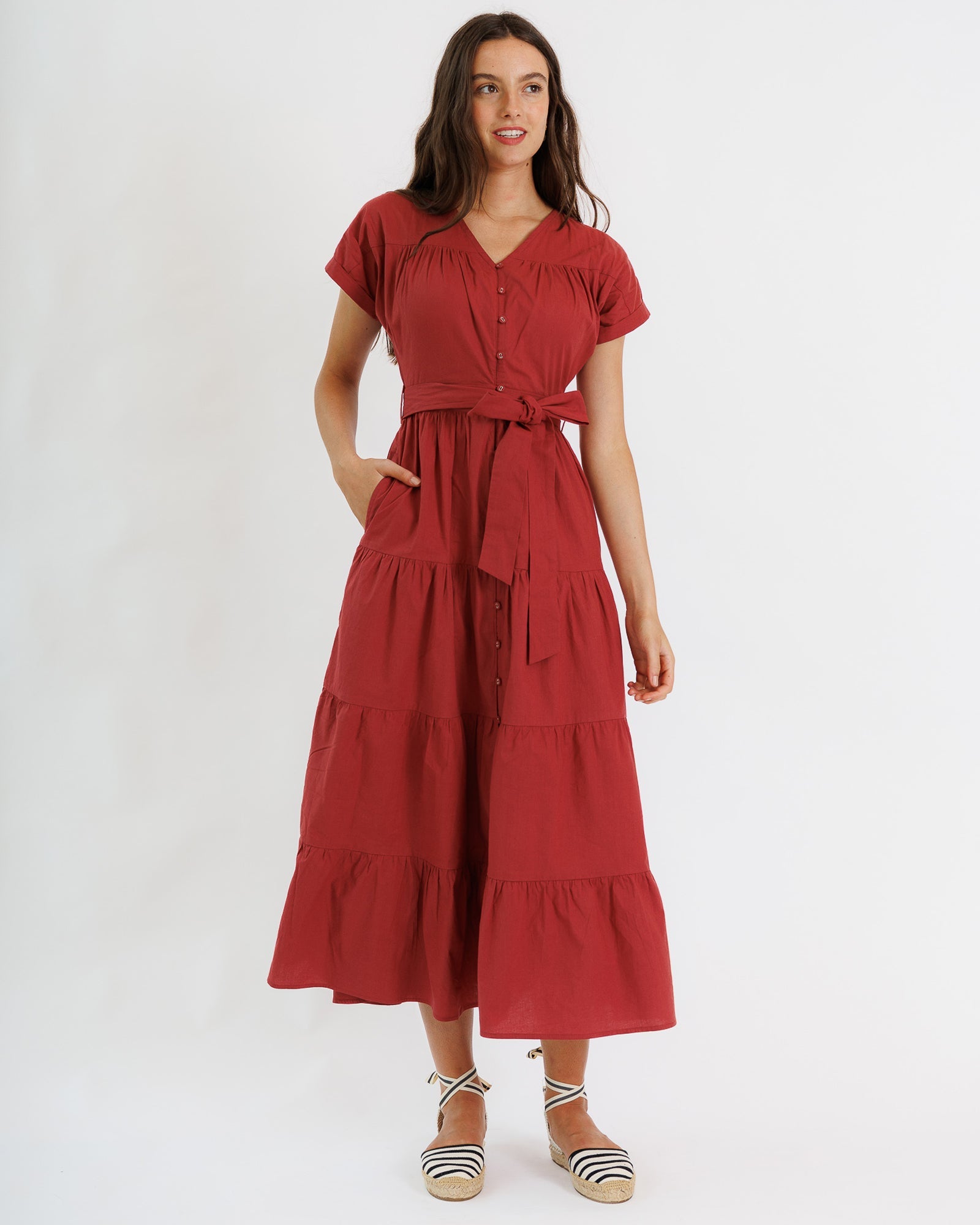 Woman wearing a red dress on a white background