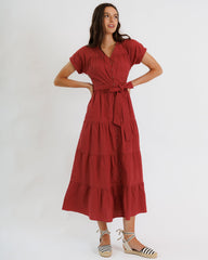 Woman wearing a red dress on a white background