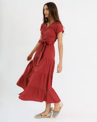 Woman wearing a red dress on a white background