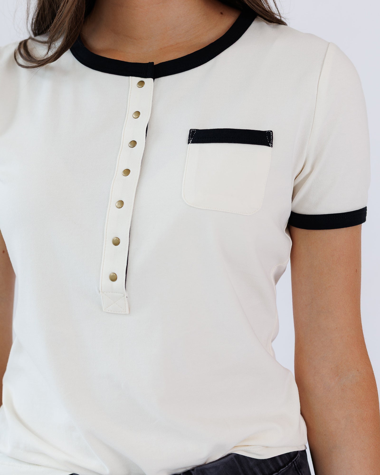 White shirt with black trim on a white background