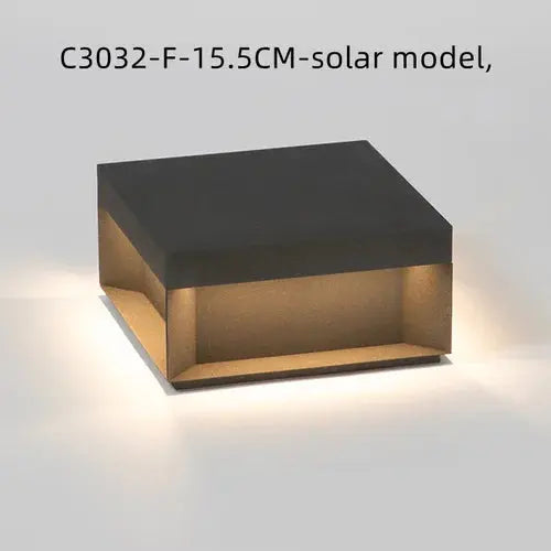 Square wall light fixture with a black and gold design on a white background