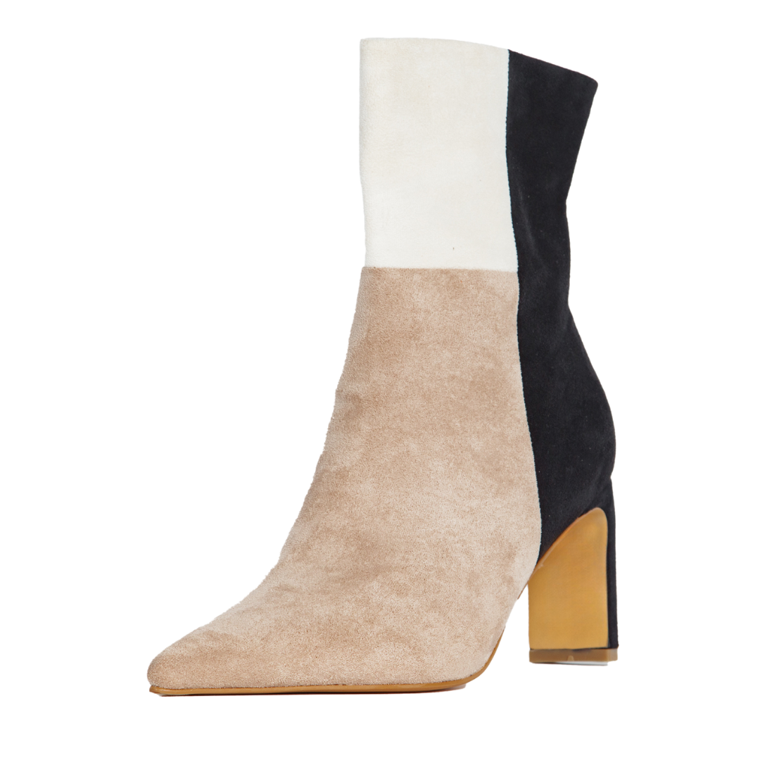 Color-blocked sock boot with white, beige, and black sections on a white background