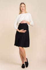 Woman wearing a white blouse and black skirt on a beige background