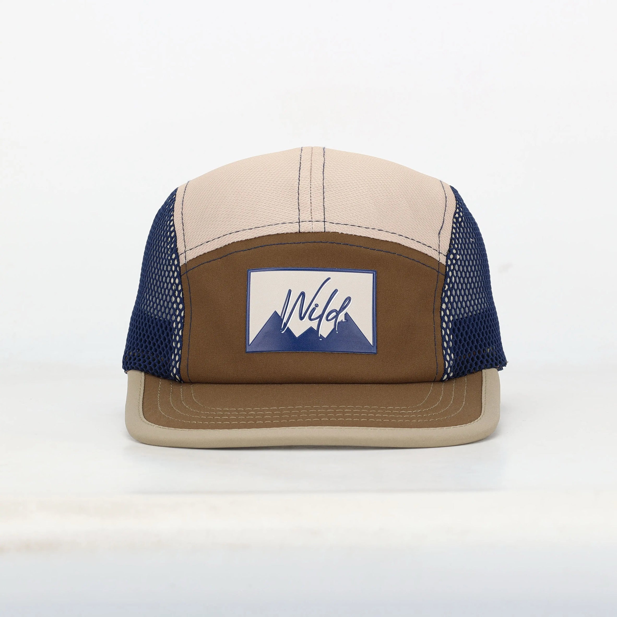Beige and brown cap with a blue and white logo on a white background