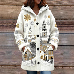 White coat with winter scene design on a wooden background