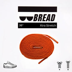 Orange shoelace with 'BREAD' branding and product details on a white background