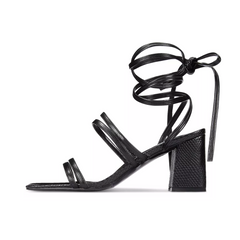Black strappy sandal with a block heel on a white background