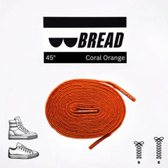 Orange shoelace with 'BREAD' branding and product details on a white background