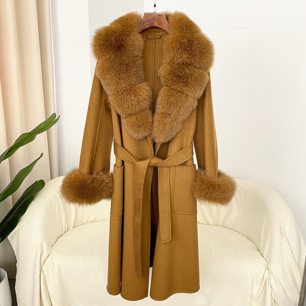 Brown coat with fur collar and cuffs on a white chair