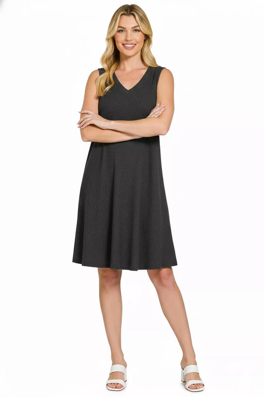 Woman wearing a black sleeveless dress on a white background