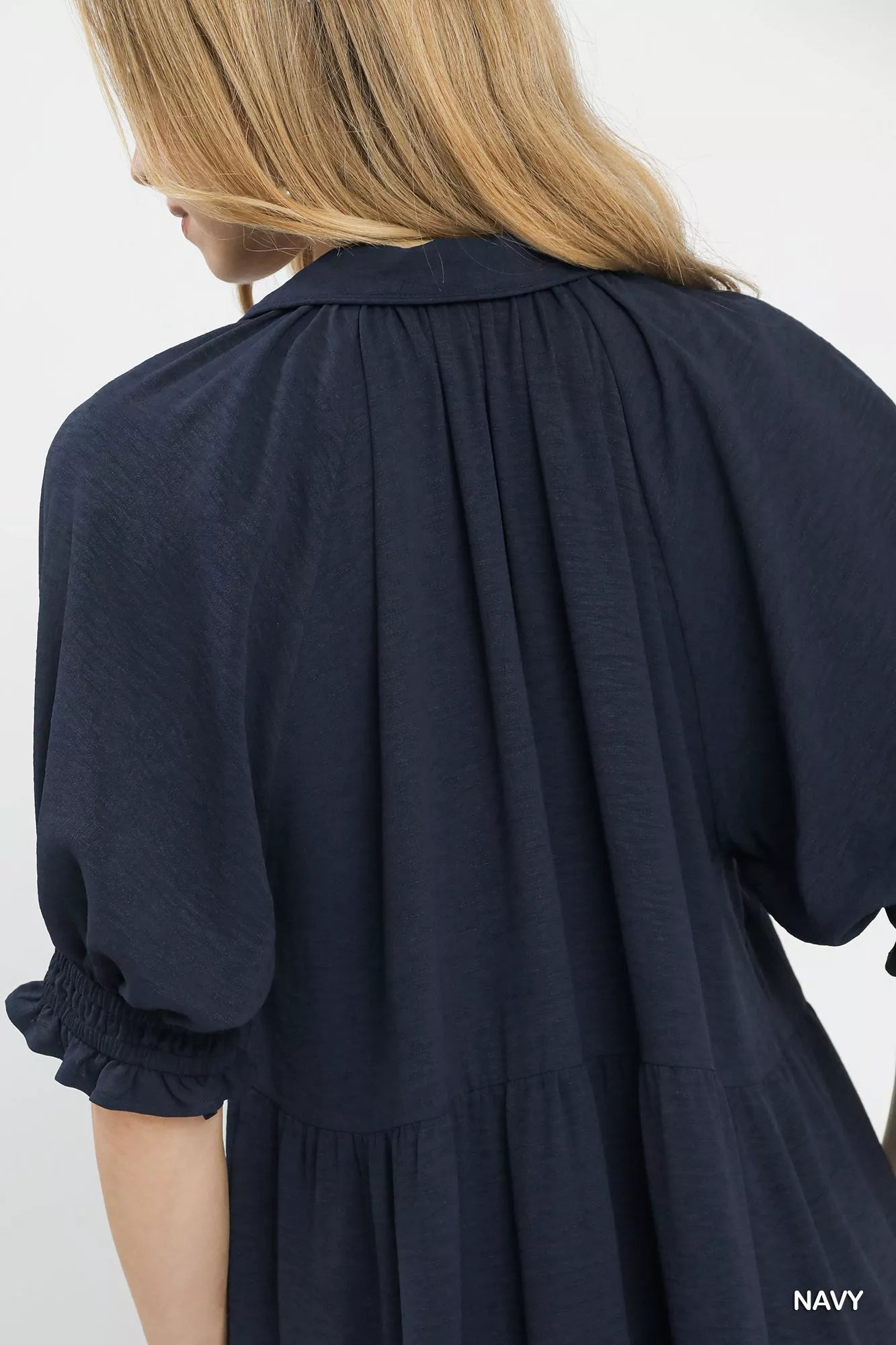Navy blue dress with a white background