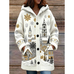 White coat with winter-themed embroidery on a wooden background