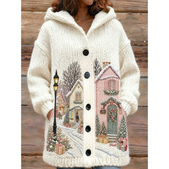Knitted cardigan with a winter scene design on a wooden background