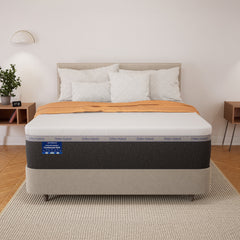 Mattress with brand logo on a bed in a bedroom setting