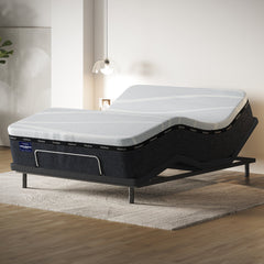 Adjustable bed with mattress in a room setting