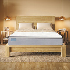 Mattress on a wooden bed frame in a bedroom setting with warm lighting.